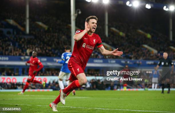 Diogo Jota of Liverpool celebrates after scoring their side's fourth goal during the Premier League match between Everton and Liverpool at Goodison...