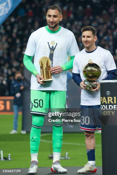 Gianluigi Donnarumma and Lionel Messi celebrate their best player and best goalkeeper for 2021 awards in front of the fans during the Ligue 1 Uber...