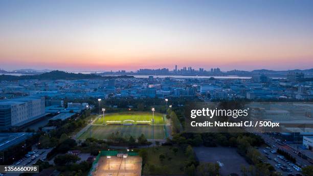 industrial park incheon city,seoul korea,high angle view of buildings against sky during sunset - songdo ibd stock-fotos und bilder