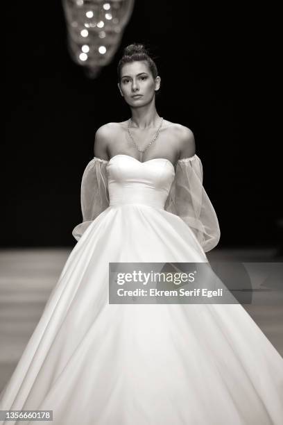 Model walks the runway at Hakan Akkaya x Cinderella Bridal Capsule Collection at Tersane Istanbul on November 30, 2021 in Istanbul, Turkey.