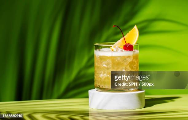 whiskey sour popular alcoholic cocktail,close-up of drink in glass on table - suor stock pictures, royalty-free photos & images