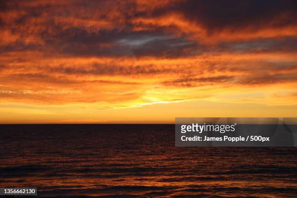 glenelg south,adelaide,scenic view of sea against dramatic sky during sunset,s esplanade,south australia,australia - james popple stock pictures, royalty-free photos & images
