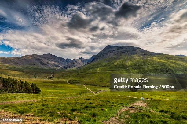 scenic view of landscape against sky,cuillin hills,isle of skye,united kingdom,uk - hill stock pictures, royalty-free photos & images