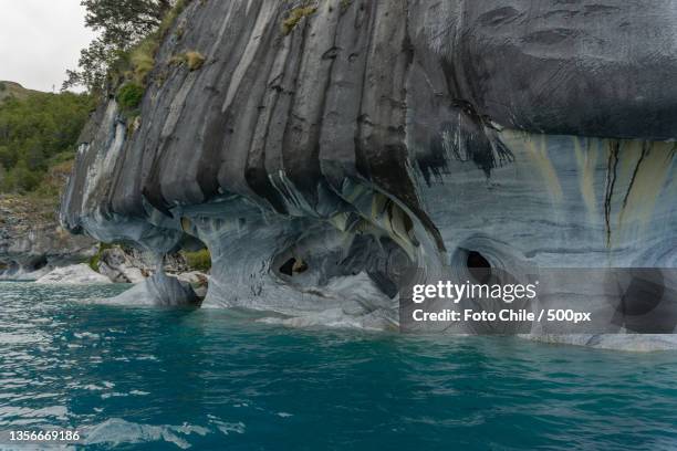 marble cathedral at chelenko lake,scenic view of sea seen through cave,chile - marble cathedral stock pictures, royalty-free photos & images