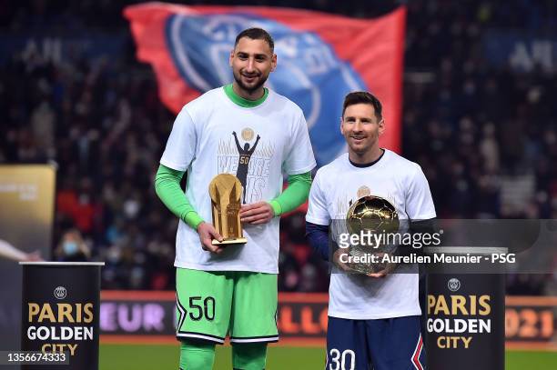 Gianluigi Donnarumma poses with the Yachine Trophy next to Leo Messi and his 7th Ballon D'Or before the Ligue 1 Uber Eats match between Paris Saint...