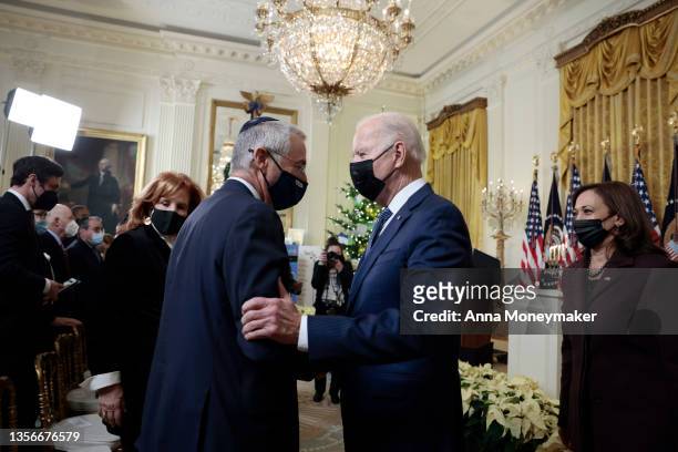 President Joe Biden shakes hands with Michael Herzog, the Israeli Ambassador to the United States after menorah lighting ceremony in celebration of...