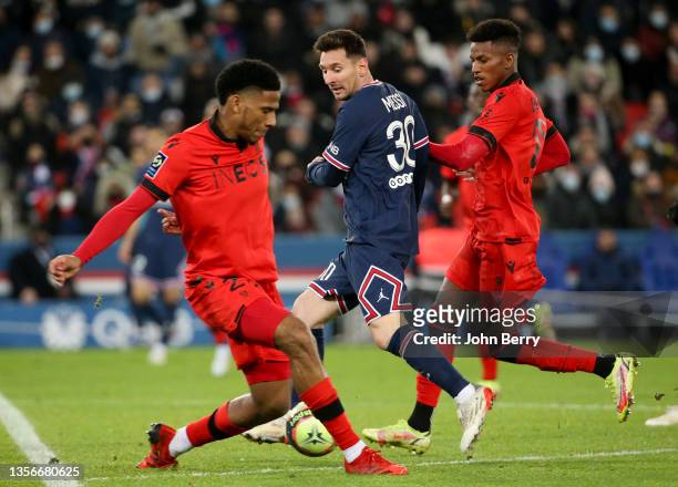 Lionel Messi of PSG between Jean-Clair Todibo and Hicham Boudaoui of Nice during the Ligue 1 Uber Eats match between Paris Saint-Germain and OGC Nice...