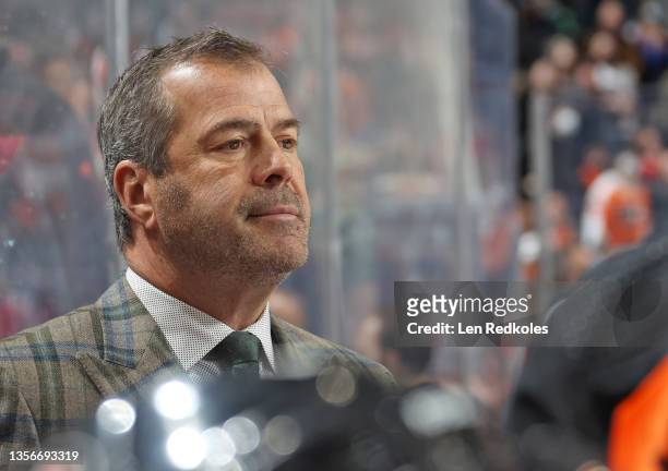 Head Coach Alain Vigneault of the Philadelphia Flyers looks on from the bench during the first period against the Carolina Hurricanes at the Wells...
