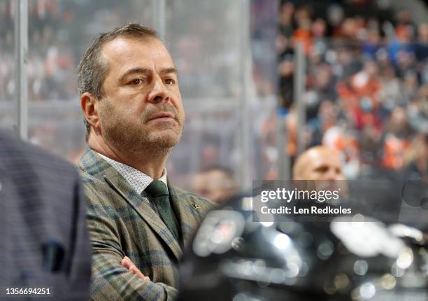 Head Coach Alain Vigneault of the Philadelphia Flyers looks on from the bench during the first period against the Carolina Hurricanes at the Wells...