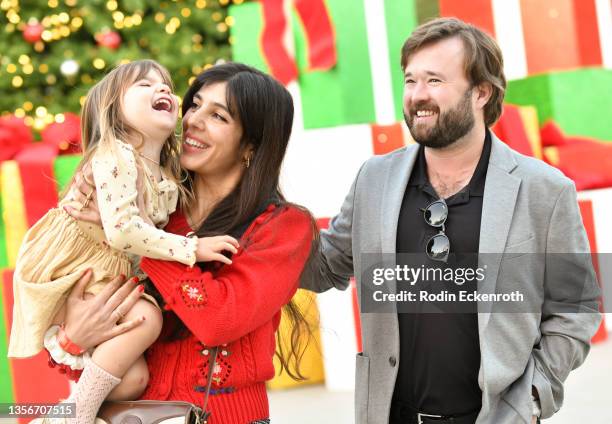 Haley Joel Osment and guests pose for portrait at the VIP preview night of The Los Angeles Dodgers' Holiday Festival on December 01, 2021 in Los...