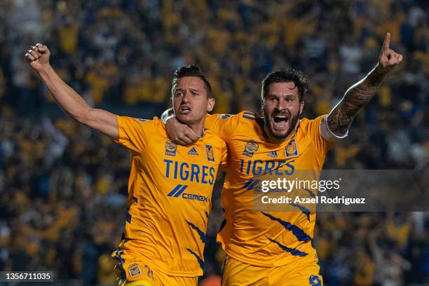 Florian Thauvin of Tigres celebrates with teammate Andre-Pierre Gignac after scoring his team’s first goal during the semifinal first leg match...