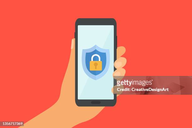 stockillustraties, clipart, cartoons en iconen met mobile security concept with human hand holding smartphone. shield with padlock icon on screen. - encryption