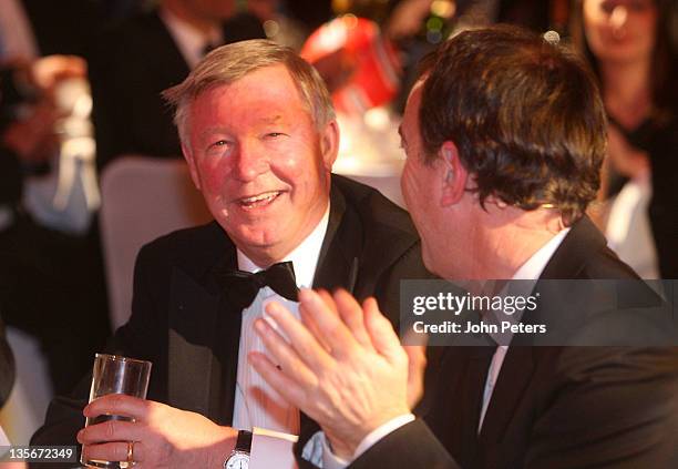 Presenter Angus Deayton and Sir Alex Ferguson of Manchester United attend an annual gala dinner, raising funds for UNICEF's global children and AIDS...