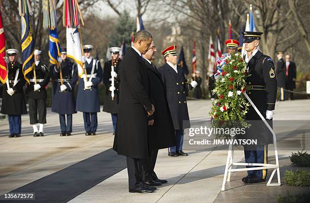 President Barack Obama and Iraqi Prime Minister Nouri al-Maliki lay a wreath at the Tomb of the unknown Soldier at Arlington National Cemetery in...