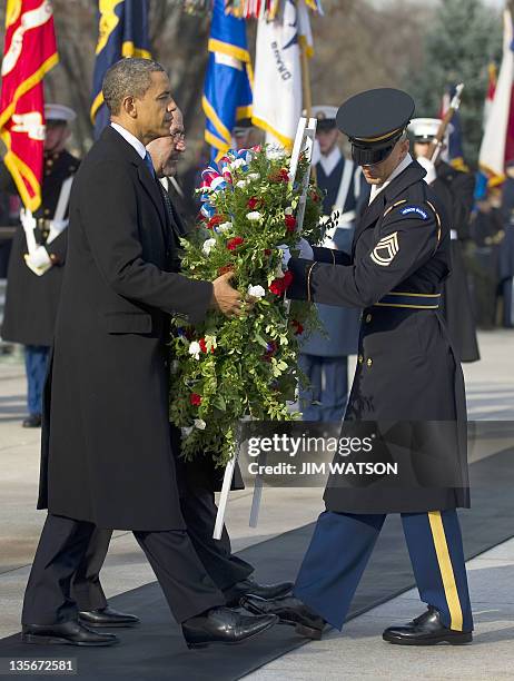 President Barack Obama and Iraqi Prime Minister Nouri al-Maliki lay a wreath at the Tomb of the Unknown Soldier at Arlington National Cemetery in...
