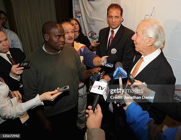 Ed Snider talks with reporters during a media availability before the 2011 US Hockey Hall of Fame Induction at the Renaissance Chicago Hotel on...