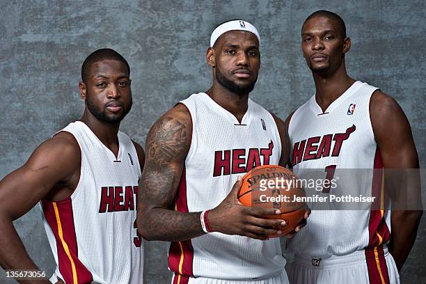 Dwyane Wade, LeBron James and Chris Bosh of the Miami Heat pose for a portrait during Media Day on December 12, 2011 at American Airlines Arena in...