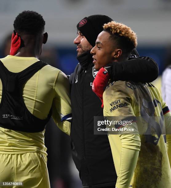 Arsenal U18 Head Coach Dan Micciche celebrates with Omari Hutchinson of Arsenal after the Papa John's trophy match between Ipswich Town and Arsenal...