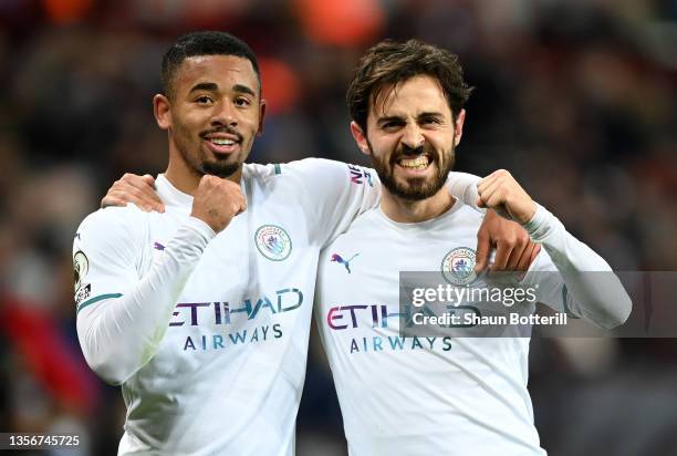 Bernardo Silva of Manchester City celebrates with team mate Gabriel Jesus after scoring their side's second goal during the Premier League match...