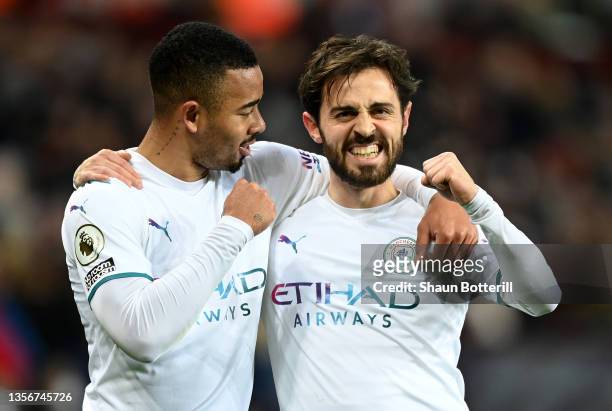 Bernardo Silva of Manchester City celebrates with team mate Gabriel Jesus after scoring their side's second goal during the Premier League match...