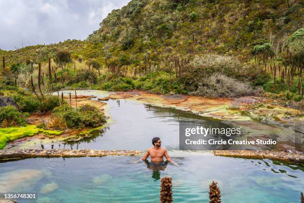 young man swimming in a hot springs  water - colombie stock pictures, royalty-free photos & images