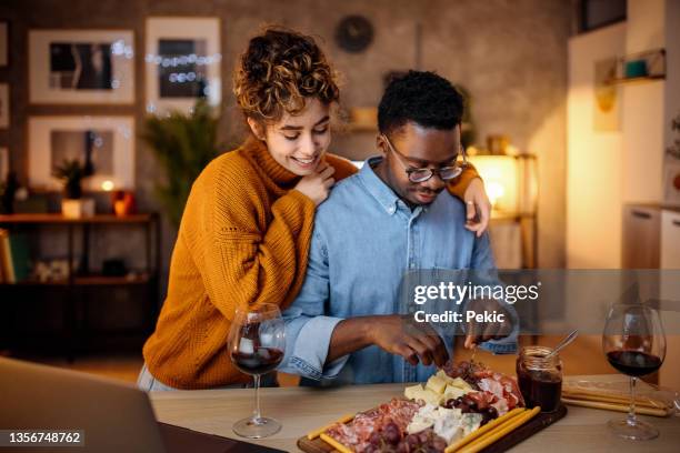 lets celebrate this together - young couple date night wine stock pictures, royalty-free photos & images