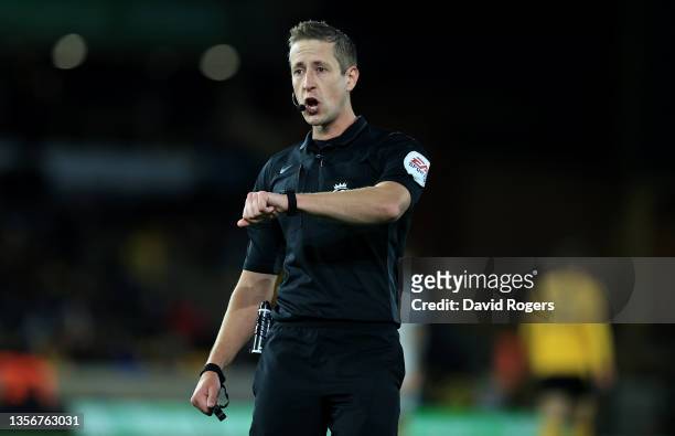 John Brooks, the referee, looks on during the Premier League match between Wolverhampton Wanderers and Burnley at Molineux on December 01, 2021 in...