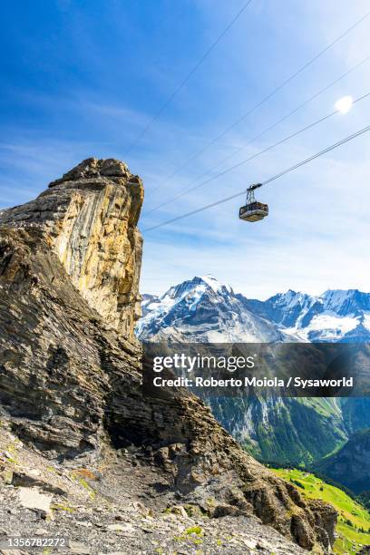 cable car in the sky toward jungfrau mountain, switzerland - bernese alps stock pictures, royalty-free photos & images