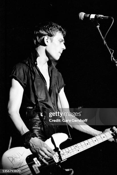 British Punk musician Paul Simonon, of the group the Clash, plays bass guitar as he performs onstage at the Capitol Theatre, Passaic, New Jersey,...