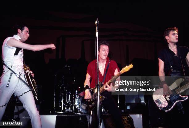Members of British Punk group the Clash perform onstage at the Capitol Theatre, Passaic, New Jersey, March 8, 1980. Pictured are, from left, Mick...