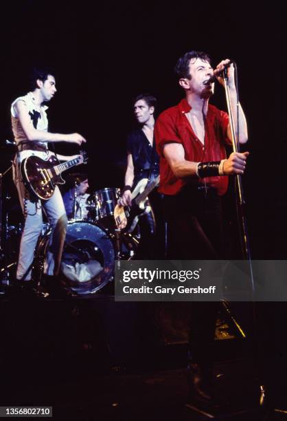 British Punk musician Joe Strummer , of the group the Clash, performs onstage at the Capitol Theatre, Passaic, New Jersey, March 8, 1980. Visible...