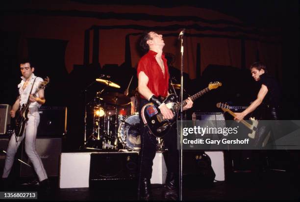 Members of British Punk group the Clash perform onstage at the Capitol Theatre, Passaic, New Jersey, March 8, 1980. Pictured are, from left, Mick...