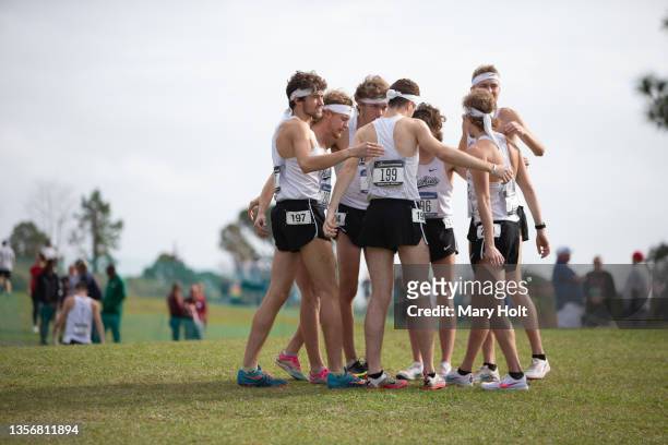 The Michigan Tech Huskies huddle during the Division II Men’s and Women’s Cross Country Championship held at the Abbey Course on November 20, 2021 in...