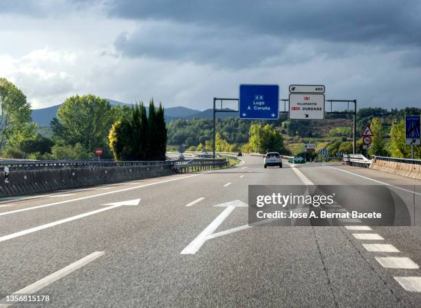 car point of view driving. cars and trucks driving on a highway at high speed. - biltransporttrailer bildbanksfoton och bilder