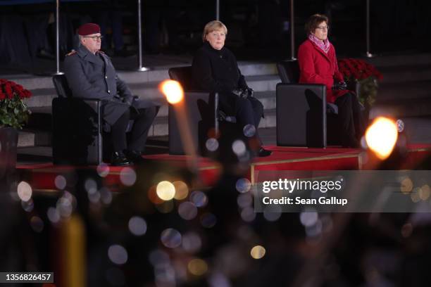 Outgoing German Chancellor Angela Merkel , flanked by General Eberhard Zorn , Inspector General of the Bundeswehr, and Defense Minister Annegret...