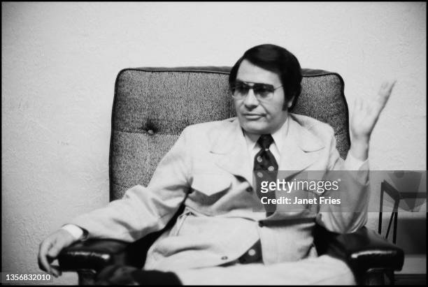 Portrait of American cult leader and founder of the People's Temple Jim Jones as he poses in his office, San Francisco, California, July 3, 1976.