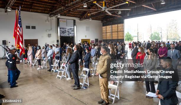 Irvine, CA Participants stand for the presentation of colors during a U.S. Naturalization ceremony at the Great Park in Irvine, CA on Thursday,...