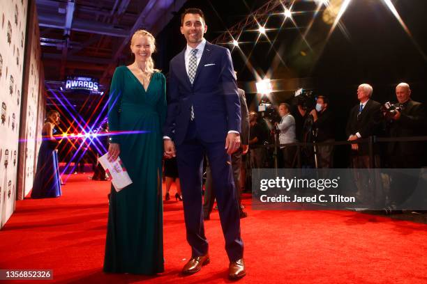 Cup Series driver Aric Almirola and wife Janice Almirola pose on the red carpet prior to the NASCAR Champion's Banquet at the Music City Center on...