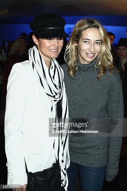 Laeticia Hallyday and Alexandra Golovanoff attend 'Les tribulations d Une Caissiere' Paris premiere at UGC Cine Cite Bercy on December 12, 2011 in...