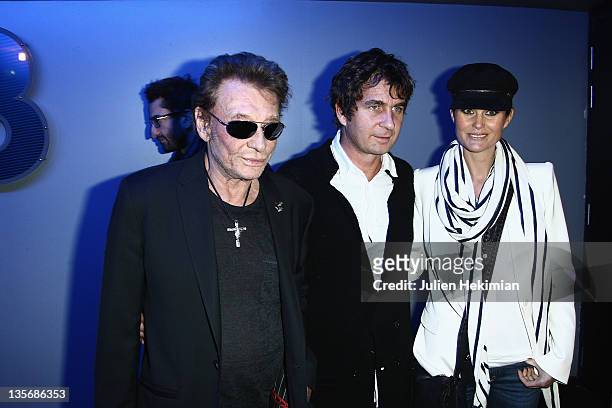 Johnny Hallyday, Pierre Rambaldi and Laeticia Hallyday attend 'Les tribulations d Une Caissiere' Paris premiere at UGC Cine Cite Bercy on December...