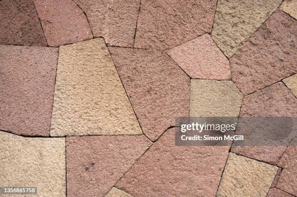 patchwork design stone surrounding wall - funky texture stock pictures, royalty-free photos & images