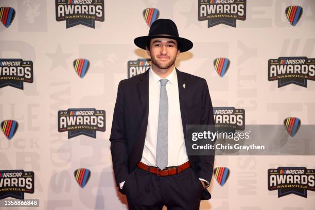 Cup Series driver Chase Elliott poses on the red carpet prior to the NASCAR Champion's Banquet at the Music City Center on December 02, 2021 in...