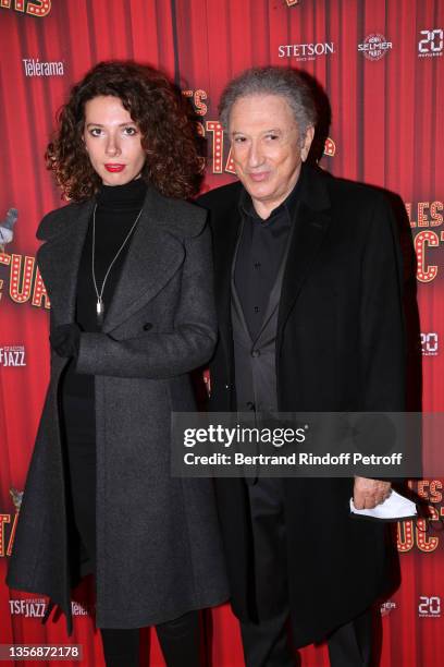 Michel Drucker and his granddaughter Rebecca attend the "Les Producteurs" Theater Play at "Theatre de Paris" on December 02, 2021 in Paris, France.