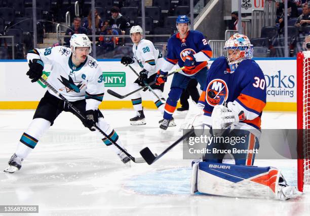 Ilya Sorokin of the New York Islanders with the third period chest save as Logan Couture of the San Jose Sharks looks for the rebound at the UBS...