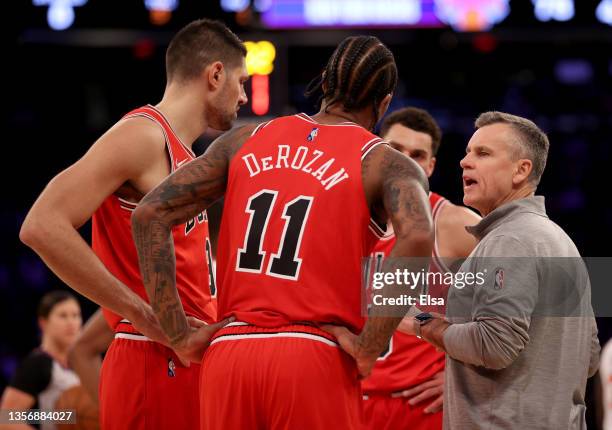 Head coach Billy Donovan of the Chicago Bulls talks with his players during a time out in the second half against the New York Knicks at Madison...