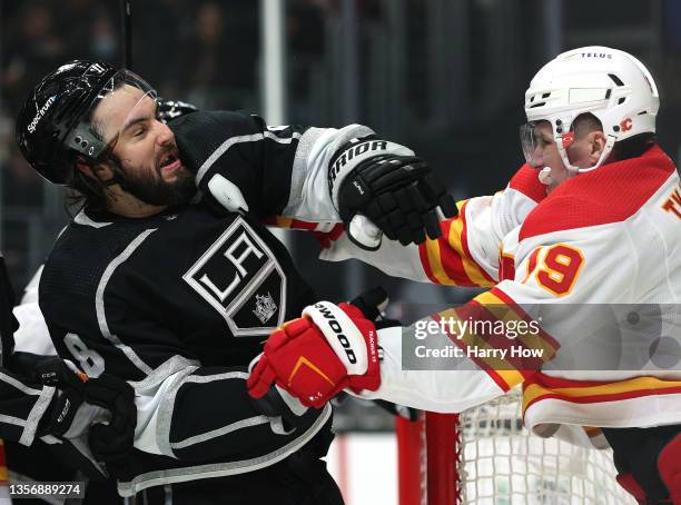 Matthew Tkachuk of the Calgary Flames takes a roughing penalty as he punches Drew Doughty of the Los Angeles Kings during the first period at Staples...