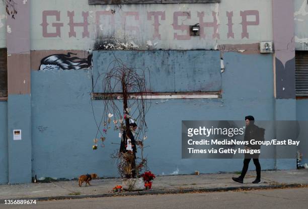 People visit a memorial sculpture in front of the Ghost Ship warehouse in Oakland, Calif., on Thursday, Dec. 2, 2021. Today is the fifth anniversary...