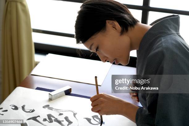 calligraphy scene - writing - calligraphy stock pictures, royalty-free photos & images