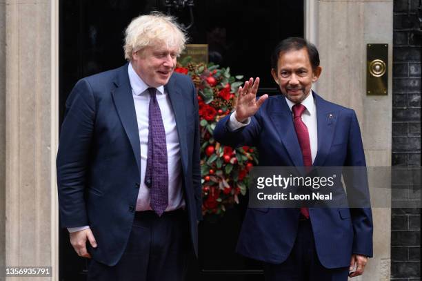 Prime Minister Boris Johnson welcomes Sultan Hassanal Bolkiah of Brunei before their meeting at 10 Downing Street on December 03, 2021 in London,...