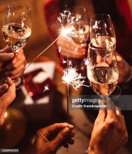new year celebration with champagne - sparkler firework stock pictures, royalty-free photos & images